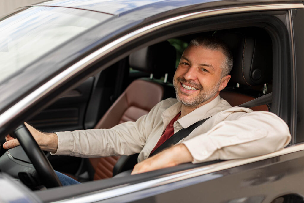 Cheerful,Middle,Aged,Man,Driving,Auto,,Looking,Through,Open,Window